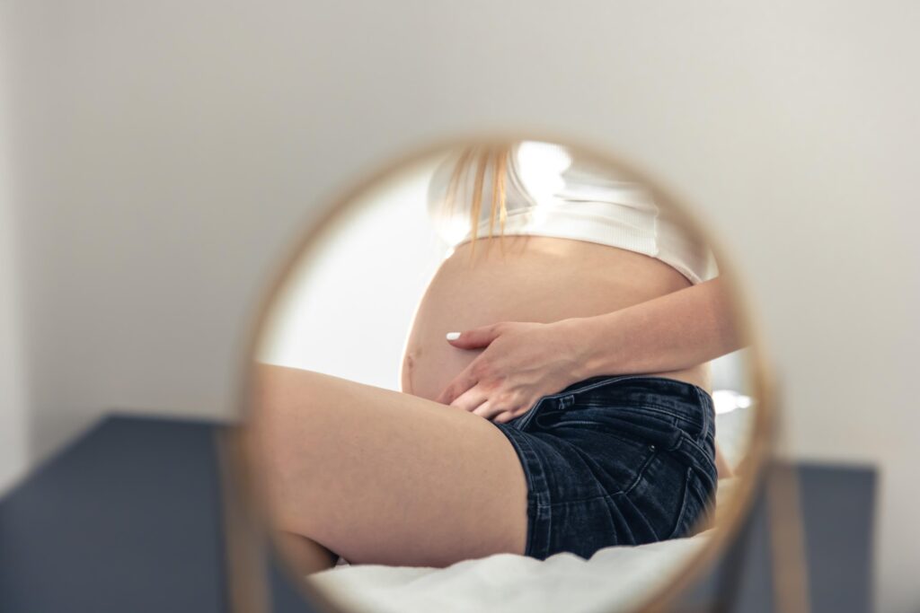 pregnant woman reflection of the belly in the mir 2023 11 27 05 17 08 utc 1