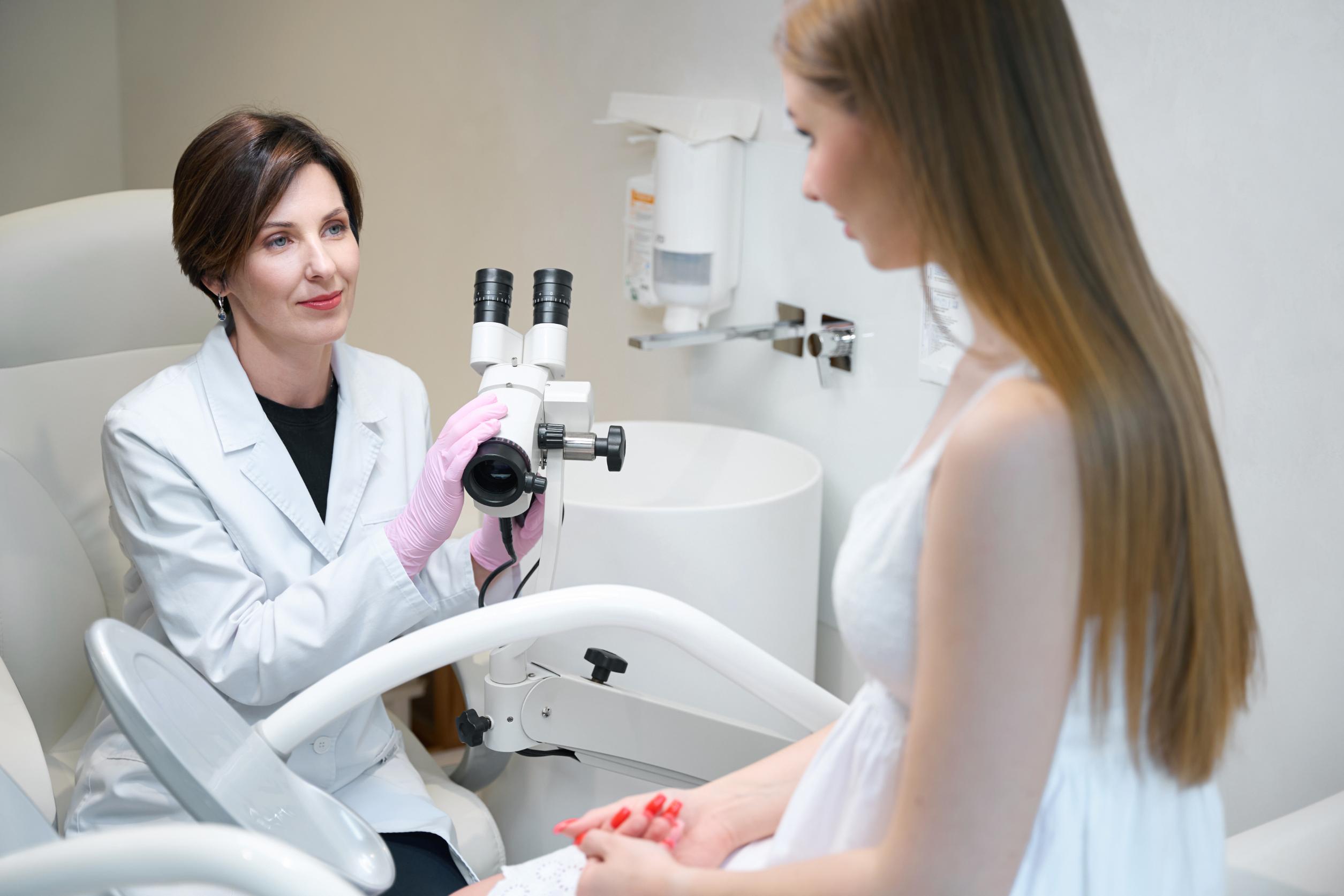 female gynecologist uses a gynecological microscop 2023 11 27 05 19 42 utc